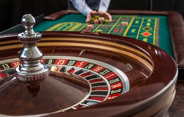 Live casino game room with multiple tables
